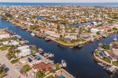 This beautifully updated Gulf Harbors waterfront home delivers