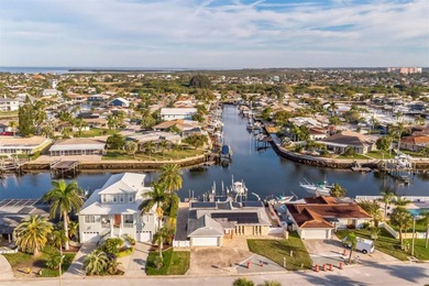 This beautifully updated Gulf Harbors waterfront home delivers