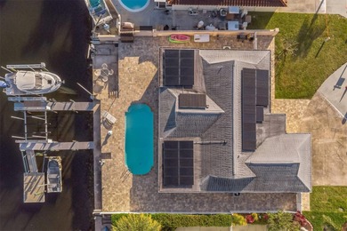 This beautifully updated Gulf Harbors waterfront home delivers