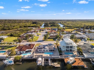 This beautifully updated Gulf Harbors waterfront home delivers