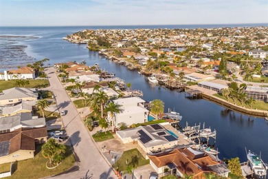 This beautifully updated Gulf Harbors waterfront home delivers