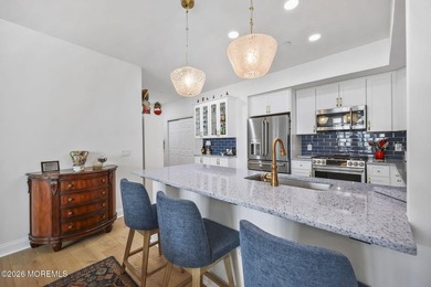 Experience refined coastal living in this lakeview end-unit - photo 12