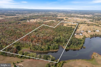 Over 106 acres of wooded and partially cleared land with - photo 2