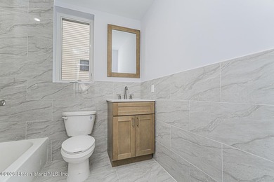 Welcome to this brand-new construction 7-over-7 two-family home - photo 11