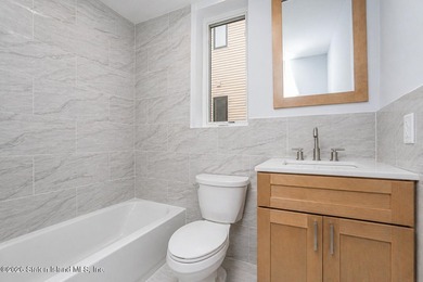 Welcome to this brand-new construction 7-over-7 two-family home - photo 12