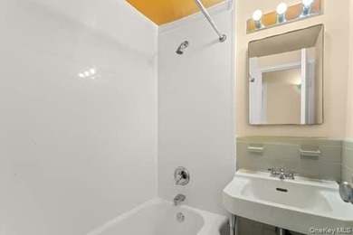 This two-bedroom unit features a master king-sized bedroom with - photo 3
