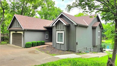 Linn Valley Lakefront living with style! From the moment you - photo 1