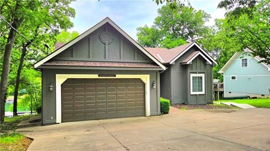 Linn Valley Lakefront living with style! From the moment you - photo 2