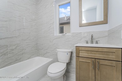 Welcome to this brand-new construction 7-over-7 two-family home - photo 27
