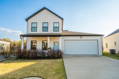 Welcome to this beautiful 4-bedroom, 3.5-bath lake home in the - photo 1