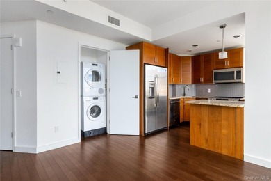 Welcome to Unit 9C at The Aston, a bright and modern high-floor - photo 3