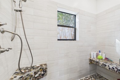 Escape to this 3BR/2BA country retreat on 12.9 acres m/l in