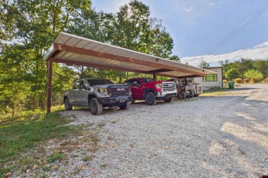 Escape to this 3BR/2BA country retreat on 12.9 acres m/l in