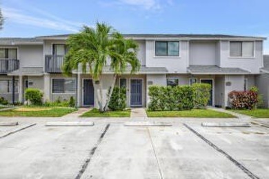 Lake Townhome/Townhouse For Sale in Greenacres, Florida