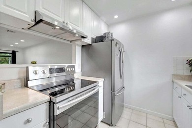 This beautifully renovated 3-bedroom, 2-bath townhome offers a - photo 2
