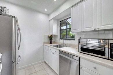 This beautifully renovated 3-bedroom, 2-bath townhome offers a - photo 3