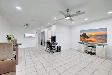 This beautifully renovated 3-bedroom, 2-bath townhome offers a - photo 4