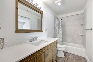 This beautifully renovated 3-bedroom, 2-bath townhome offers a - photo 6