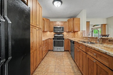 Enjoy picturesque golf course & pond views from this beautiful - photo 5