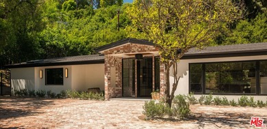 Tucked behind gates in prime Encino, this warm organic-modern - photo 3