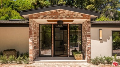 Tucked behind gates in prime Encino, this warm organic-modern - photo 4