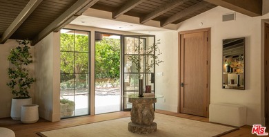 Tucked behind gates in prime Encino, this warm organic-modern - photo 5
