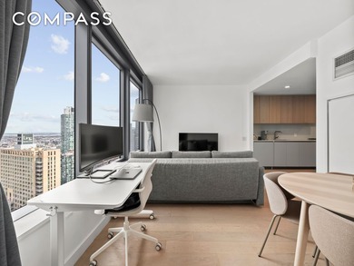 This high-floor, northeast-facing one-bedroom apartment offers a - photo 3