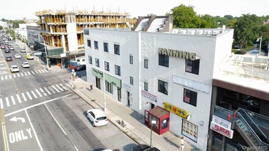 Corner three-story commercial building on Northern Boulevard in - photo 1