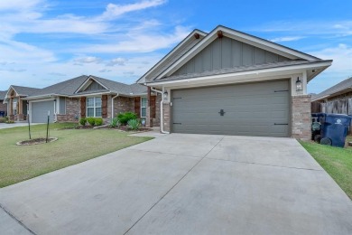 Welcome to this stunning Craftsman-style home located at 9441 NW