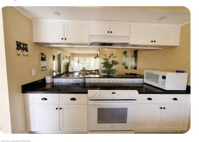 Step into a tastefully, fully furnished 2nd-floor condominium in - photo 8