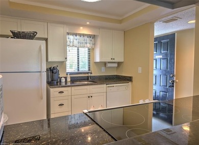 Step into a tastefully, fully furnished 2nd-floor condominium in - photo 9