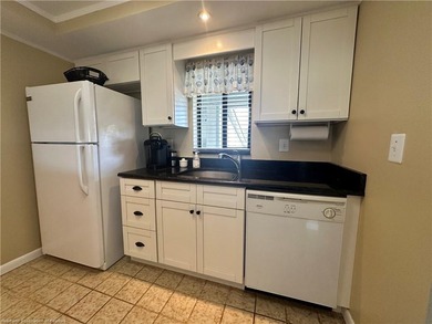 Step into a tastefully, fully furnished 2nd-floor condominium in - photo 10