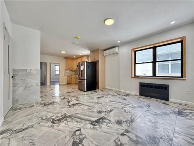 Beautifully renovated semi-detached two-family home on a 25' x - photo 25