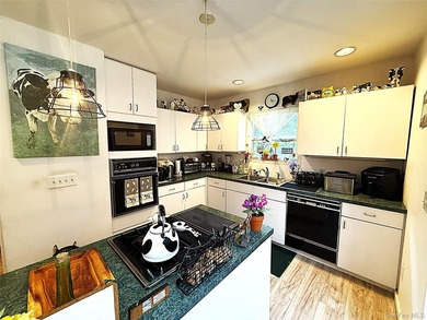 Experience timeless elegance in this impressive 5 bedroom, 2.5 - photo 8