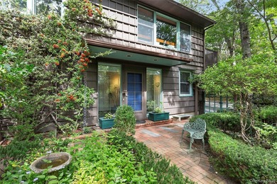 *A Peaceful Retreat Among the Trees.* Designed to embrace its - photo 2
