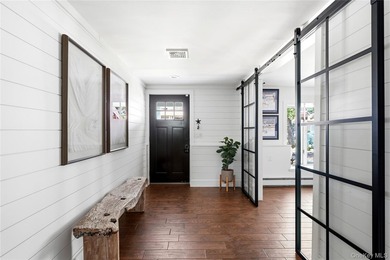 Welcome to this tastefully updated 4-bedroom, 3-bath home in one - photo 5