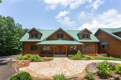 Welcome home to this custom builder's retreat with metal roof &
