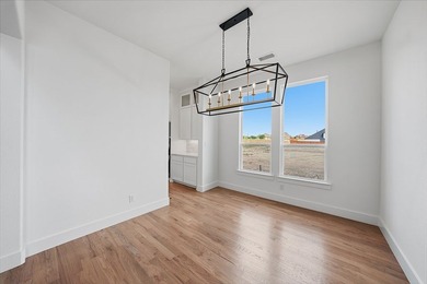 Popular open concept home features a dramatic two-story entry - photo 7
