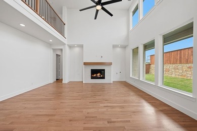 Popular open concept home features a dramatic two-story entry - photo 9