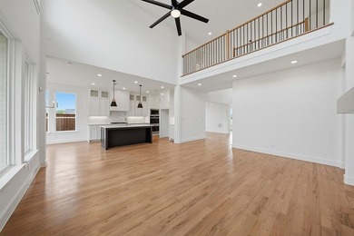 Popular open concept home features a dramatic two-story entry - photo 10