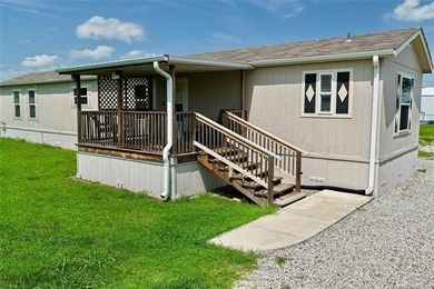 Welcome to lake living in the desirable Belle Starr Addition on - photo 2