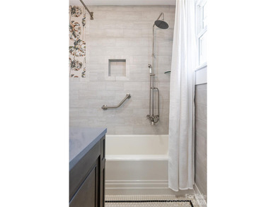 There is a warm, inviting grace to this Grove Park home that - photo 16