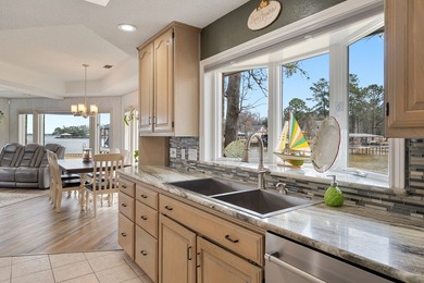 This extraordinary lakefront retreat is a true architectural gem