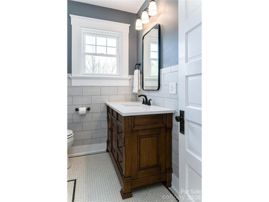 There is a warm, inviting grace to this Grove Park home that - photo 20