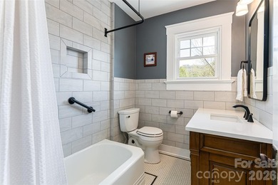 There is a warm, inviting grace to this Grove Park home that - photo 24