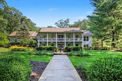 Set gracefully beyond a long, tree-lined drive, this - photo 3