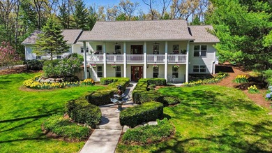Set gracefully beyond a long, tree-lined drive, this - photo 9