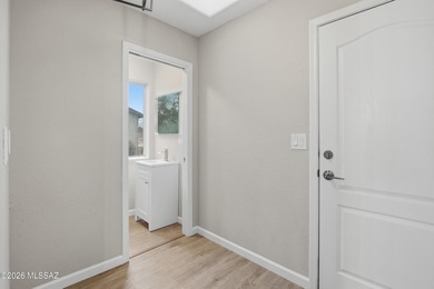 This better-than-new beauty nestled in the desired Country Club