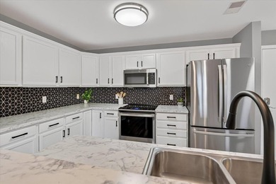 Welcome to easy living at a quiet condo community in the heart - photo 5