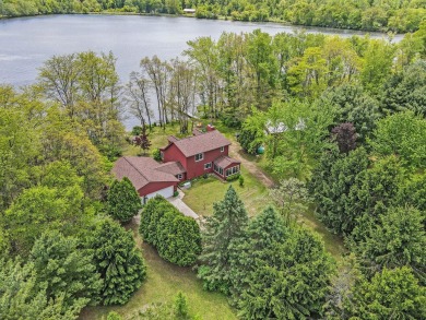 Situated on approximately 4.7 acres, this three-bedroom - Lake Home For Sale in Allegan, Michigan